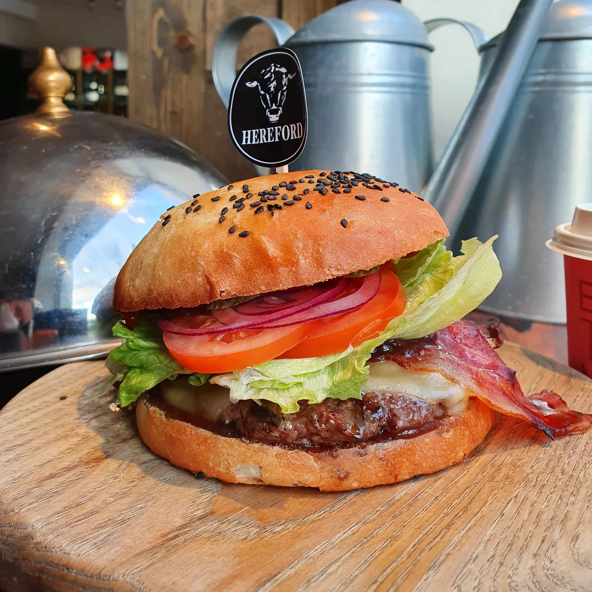 Fresh beef burger with lettuce, tomato and cheese on toasted bun